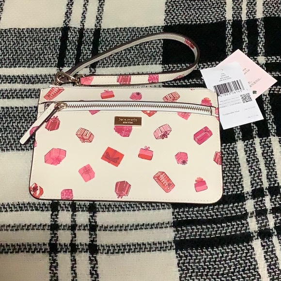kate spade Handbags - Kate Spade pink gift printed tinie wristlet wallet